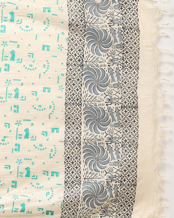 Off white and slate blue Katan silk unstitched suit set hand block printed with stylised swirls and fish motifs in an asymmetric repeat, with teal and charcoal grey accents and fringed edges.