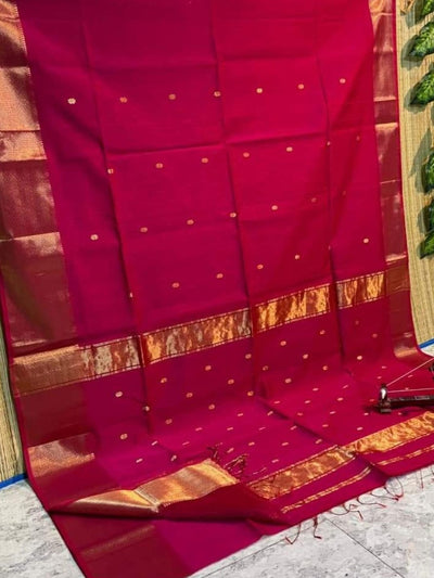 Crimson pink Maheshwari silk saree with a double design golden zari border and flower buti worked across the body and pallu.