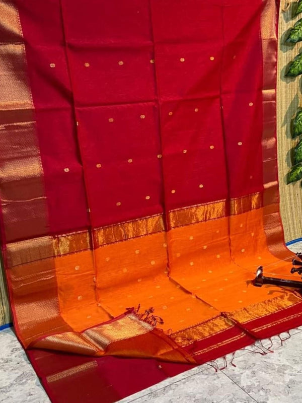 Dark red Maheshwari silk saree with a bicolour orange flower buti pallu, golden double design zari border and contrast blouse piece.