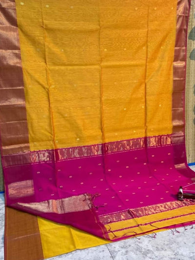 Goldenrod yellow Maheshwari silk saree with a contrast magenta flower buti pallu, bronze-gold double design zari border and contrast blouse piece.