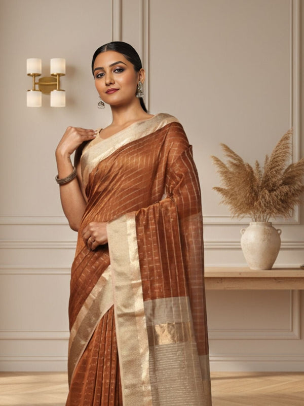 Earthy brown handloom Maheshwari silk saree with allover checks and a wide golden contrast pallu
