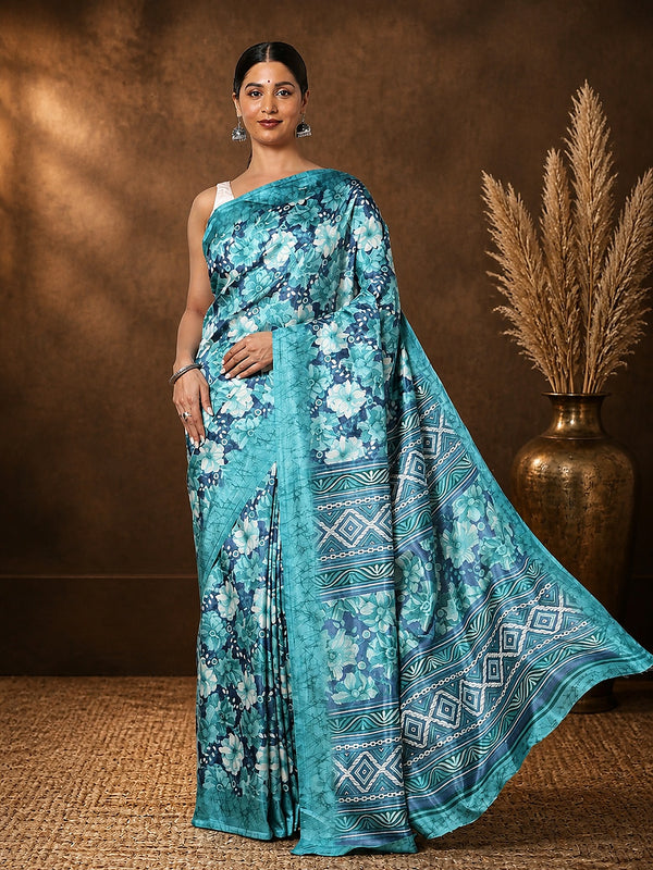 Teal and turquoise floral printed Kashmiri Silk saree with a wide geometric diamond-band pallu in white.
