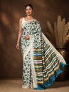 Off White Kashmiri Silk printed saree with an all-over teal and olive botanical leaf print and a wide end-panel of teal, olive-green and dark-brown stripes over an off-white base, with a narrow textured border.