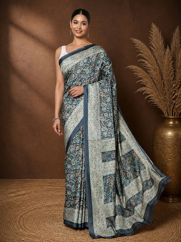 Dark grey printed saree in an all-over paisley and floral vine print with teal and mustard accents and a narrow grey border.