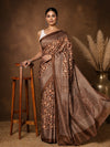 Brown printed saree in a floral paisley print with orange and green, a wide lattice border and a large medallion pallu.