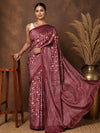 Maroon printed saree in a floral and paisley print with pink and green, edged by a broad, densely patterned border.