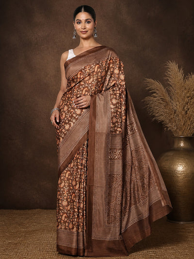 Brown Kashmiri Silk printed saree with a dense all-over floral and paisley print in orange and pale yellow, a geometric-lattice pallu and a repeating geometric-grid border.