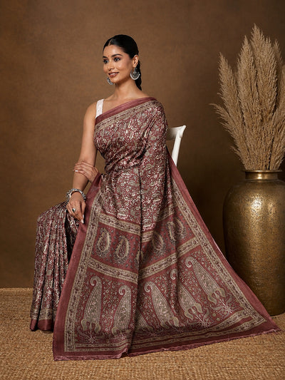 Maroon and dusty-rose Kashmiri Silk printed saree with large-scale paisley motifs and dense floral vines, an oversized paisley pallu panel and a narrow floral border.