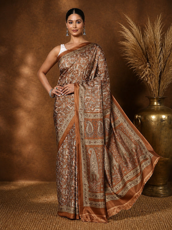 Brown and bronze Kashmiri Silk printed saree with an all-over paisley and floral-vine print, a wide pallu of large paisley motifs in a geometric frame and a narrow brown border.