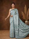 Grey-blue printed saree in a paisley and scrolling floral vine print with a wide patterned pallu panel.