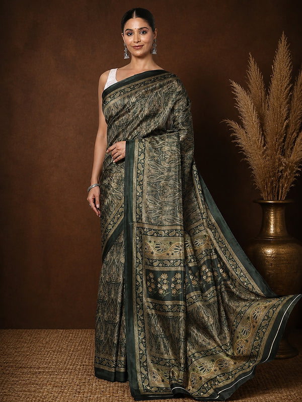 Dark green Kashmiri Silk printed saree with an all-over paisley and botanical floral print in olive, beige and brown, a blocked pallu and a dark-green border carrying a small paisley pattern.