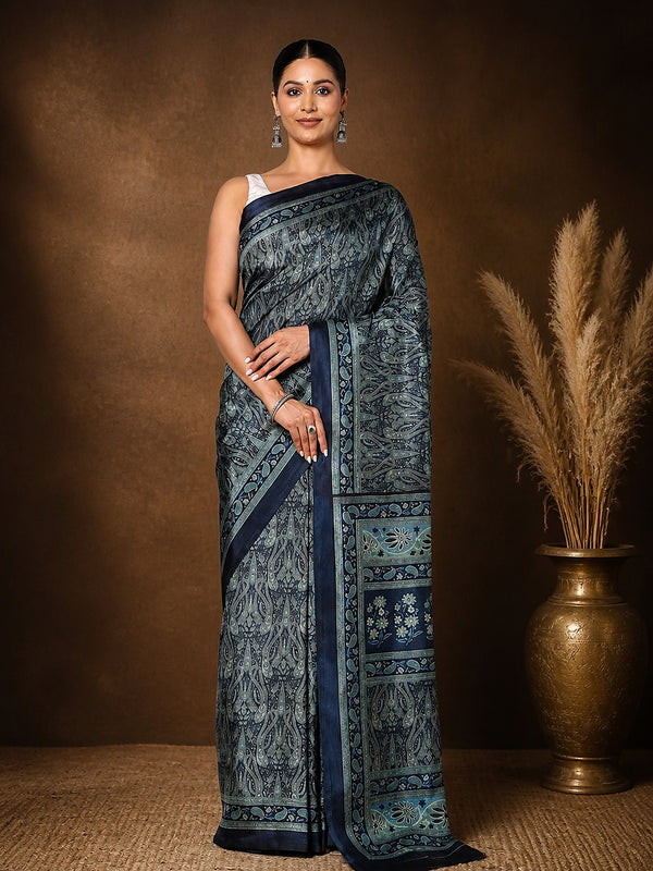 Dark blue Kashmiri Silk printed saree with an all-over paisley print in slate, light blue and teal, a multi-panelled pallu of floral blocks and geometric bands and a narrow dark-blue border.