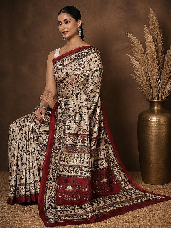 Beige printed Kashmiri silk saree with a two-tone maroon Warli-style figurative print of tribal figures and trees, and a wide maroon border stacked with rows of figures.